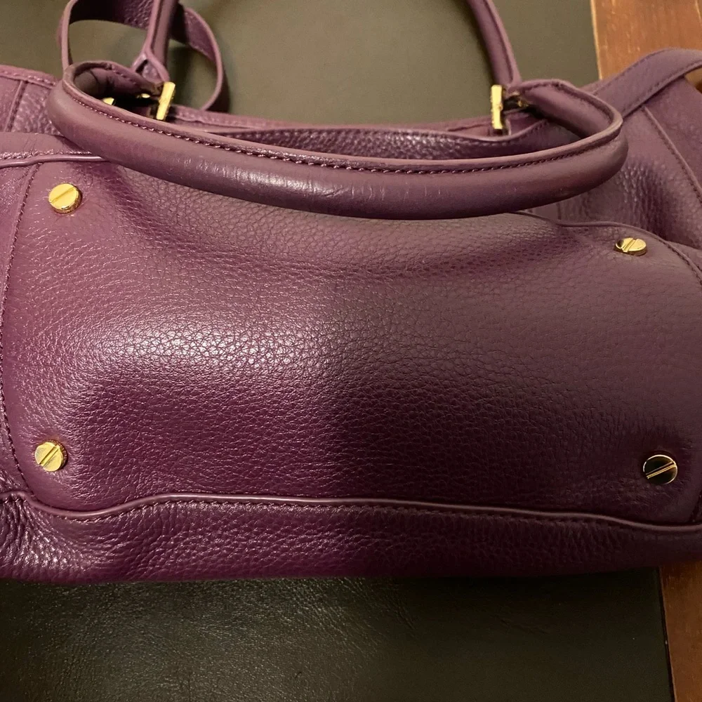 Tory Burch purple bag.
